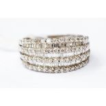 A seven row diamond set dress ring, comprising alternate rows of baguette cut and brilliant cut