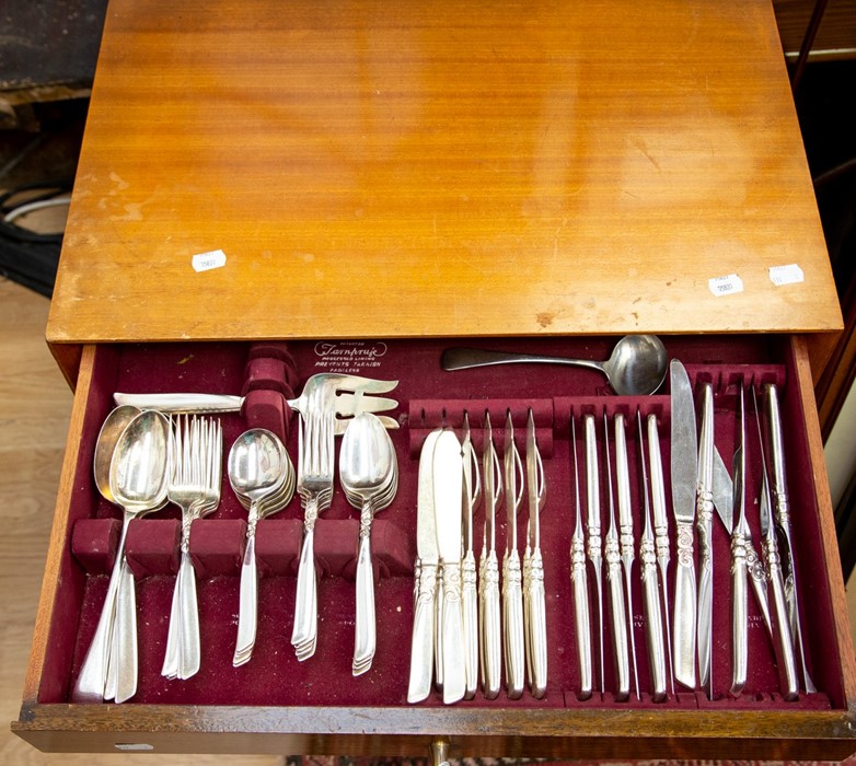 A 1960's canteen of cutlery, stainless steel, the canteen is on legs with three drawers