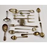 Collection of various silver items including large bread fork, pickle fork, tea spoons, part vesta