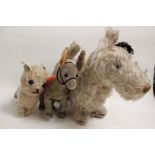 A Farnell 'Alpha' toy Terrier Dog, together with another plush dog, and felt covered donkey. (3)