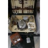 A 1920's Sirrum motoring picnic set, an early electromagnetic device and Martel miniature (3)