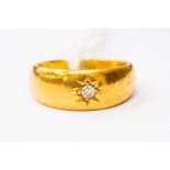 A 22ct gold and diamond ring, star set diamond, size M, total gross weight approx 7.6 grams