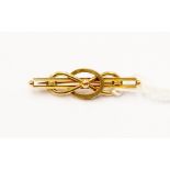 A 15ct gold brooch, knot effect decoration, length approx 40mm, total gross weight approx 3gms
