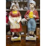 A pair of possibly Dutch pottery figures of maids