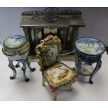Four dolls house pieces including metal fireplace, two ceramic blue and white tripod tables and