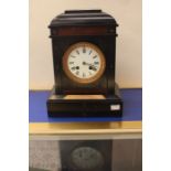 A mantle clock in slate, 1892, with key