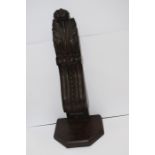 An ornate carved wooden wall bracket