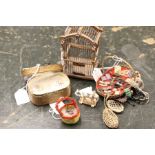 A collection of dolls house pieces including birdcage, sewing basket and fox terrier push along toy