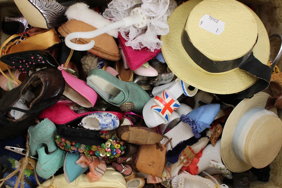 A collection of miniature ladies accessories including shoes, hats and bags, various styles and