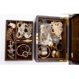 A collection of costume jewellery to include silver sweetheart brooches, crucifix and medallion,