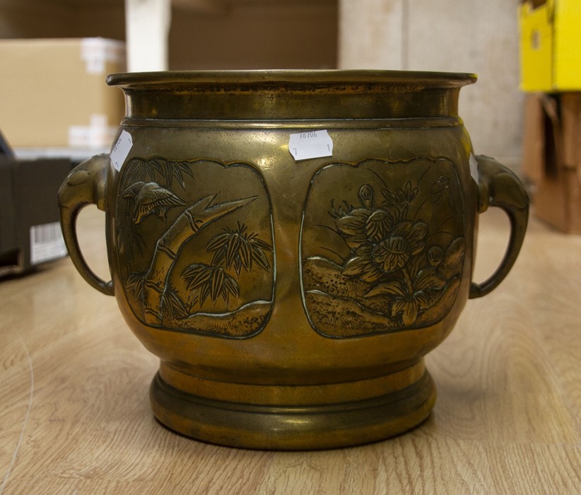 Brass jardiniere with floral detailing and elephant head handles