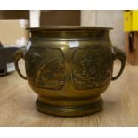 Brass jardiniere with floral detailing and elephant head handles