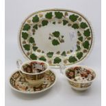 An early 19th Century Derby Ivy Pattern plate with two early Duesbury Pattern tea cups and one