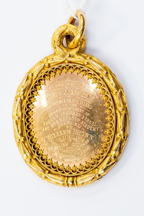 A 15ct gold medallion, the oval medallion presented by James Coates Esq providence Rhode Island to