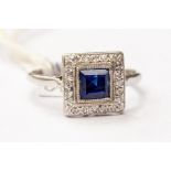 A sapphire and diamond cluster ring, the square cut sapphire weighing approx 0.90ct, diamond set