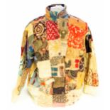 A patchwork men's jacket in style of an Indian mid century patchwork jacket with Batik fabric and