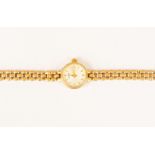 A 9ct gold ladies Rotary watch, round champagne dial, batons, diameter approx 13mm, on a 9ct gold