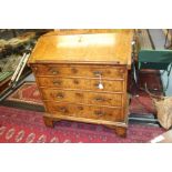 An early 18th Century walnut bureau, with fitted interior and three drawers