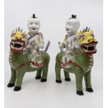 Pair of modern Dresden figures of Buddha on a dragons back