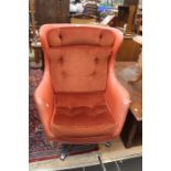 Red/orange retro leather swivel chair, with corduroy seat pad.