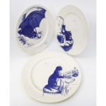 Three Poole Pottery blue and white cat plates, made for the National Trust inspired by examples from
