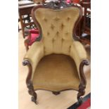 A Victorian mahogany button backed upholstered chair