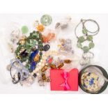 A mixed collection of costume jewellery to include semi precious polished gems, earrings, vintage
