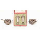 A pair of Sheffield silver pepper pots in red leather box and a pair of Birmingham silver mustard