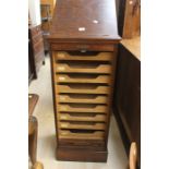 A small 20th Century filing cabinet with cantilever front and key.