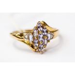 A 9ct stone cluster ring, marquise cut tanzanite stones set in a diamond shaped cluster design,  9ct