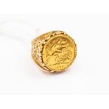 A half sovereign mounted ring, dated 1925, set in 9ct gold fancy mount, size M, total gross weight