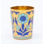 A gilt metal Continental enamel beaker floral decoration in blue and turquoise cold enamel
