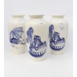 Three Poole Pottery blue and white cat design vases, two patterns, 21 cms in height approx