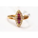 A Victorian style ruby and diamond cluster ring, marquise shaped head set with an three rubies