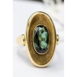 A 14ct gold and tourmaline ring, oval shape set with a green oval tourmaline, size N, total gross