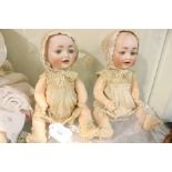 Hertel Schwab (German), number 151, pair of baby dolls, 11" tall approx, circa 1920, bisque head,