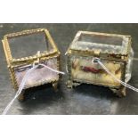 Two French glass caskets with gilt ormolu detail - one square in form with silk interior and other