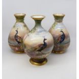 Three Crescent hand painted early 20th Century vases with peacocks