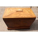 An early Victorian mahogany sarcophagus cellar with quadruple triangular top on a plinth platform