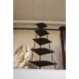 A Victorian oak five tier corner whatnot of bow fronted outline.