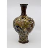 A Royal Doulton Lambeth baluster shaped vase, brown flambe ground decorated with foliage and flowers