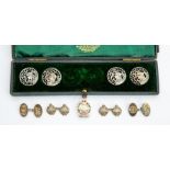 Cased white metal, early 20th Century buttons, along with silver tank veterans cufflinks and badge