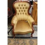 A mahogany button backed chair upholstered in gold velvet. a/f