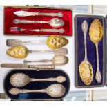 A pair of Edward VII silver fruit spoons in case; a pair of Victorian berry spoons; a pair of