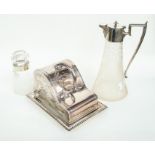 A silver plated butter dish, glass decanter with plated lid and a silver topped glass jar