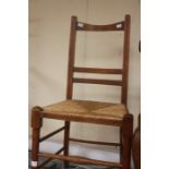 One rush seated oak chair.