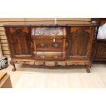 Mahogany Serpentine fronted sideboard. Raised on tailored legs.