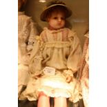 Antique wax doll, in the style of maker Charles Pierotti, circa 1850, she has soft body, wax head