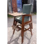 A 20th Century child's high chair.