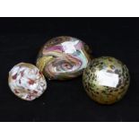 Three Isle of Wight glass paperweights, one form of a pig, one lustre ball and one fat pebble shaped